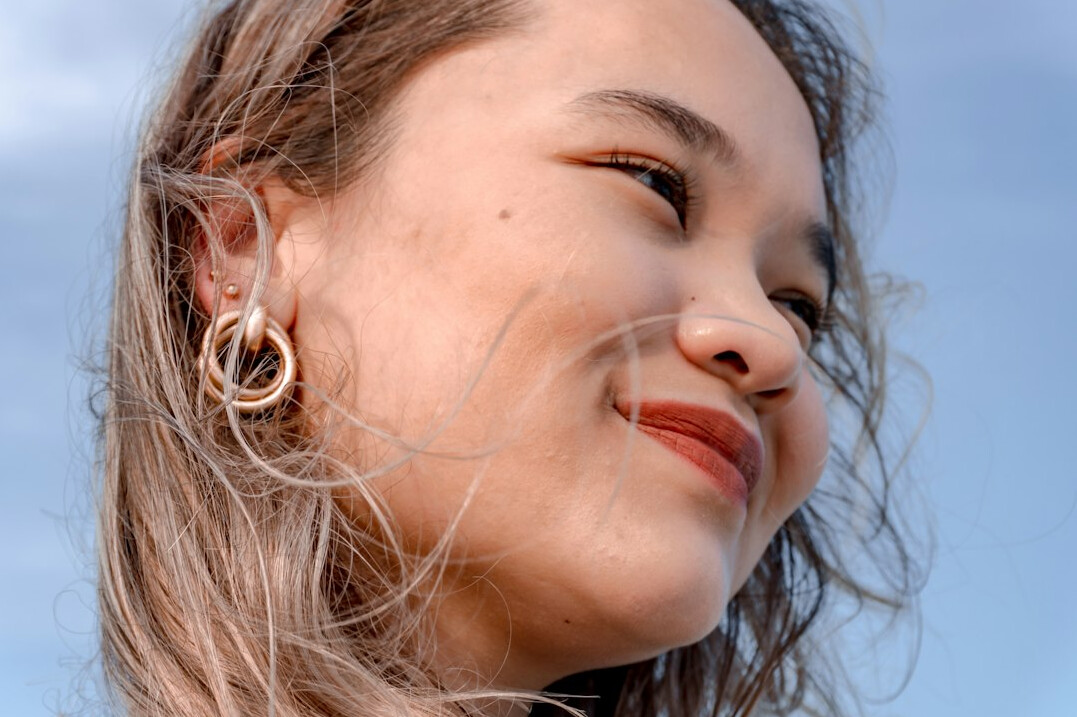 Portrait of a woman with long hair smiling